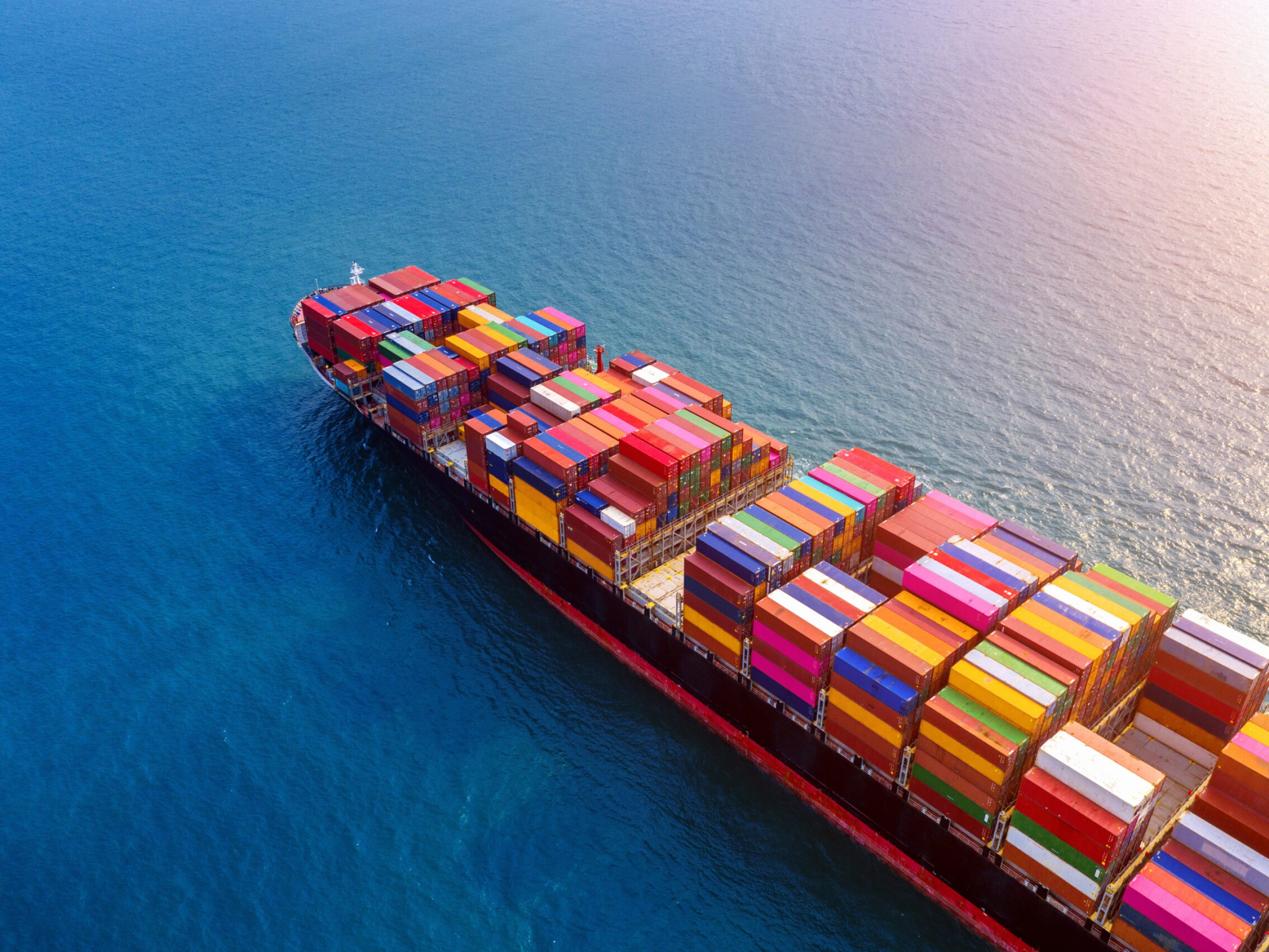 Aerial view of container cargo ship in sea.